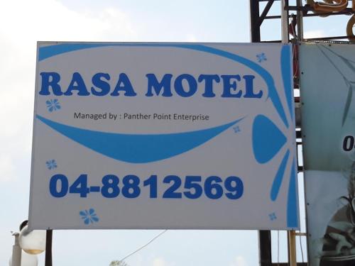 a sign for a rasa motel is shown at Rasa Motel in Batu Ferringhi