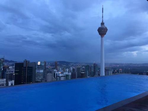 a swimming pool with a view of a city at Platinum KLCC Serviced Suites in Kuala Lumpur