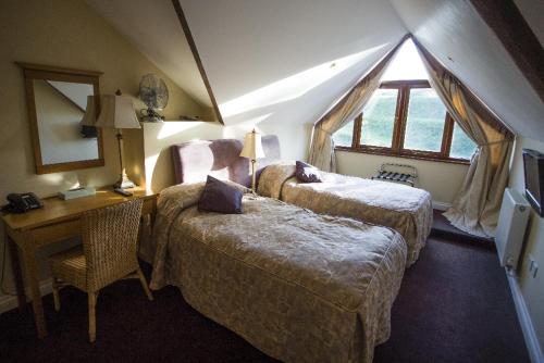 Llit o llits en una habitació de Hornsbury Mill