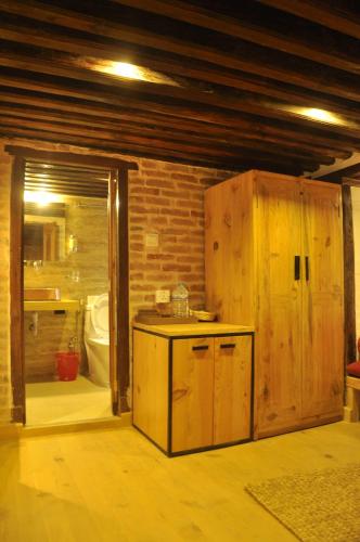a bathroom with a sink and a toilet in a room at Boutique Heritage Home in Pātan
