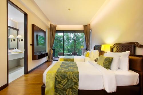 Letto o letti in una camera di Rimnaam Klangchan Hotel - SHA Plus