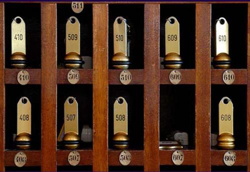 a wooden wine cellar door with bottles of wine at Sun Beach in Ajaccio
