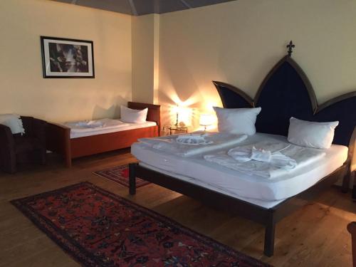 Postel nebo postele na pokoji v ubytování Pension Tempelhof