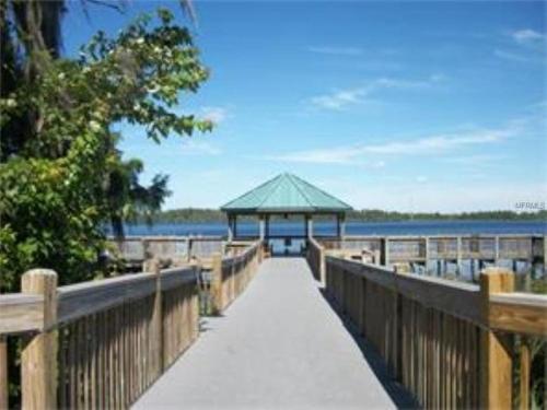 a boardwalk leading to a gazebo on the water at Condo Blue Heron in Orlando