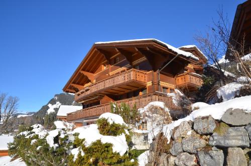 a log cabin in the snow on a mountain at Apartment Paradise - GRIWA RENT AG in Grindelwald
