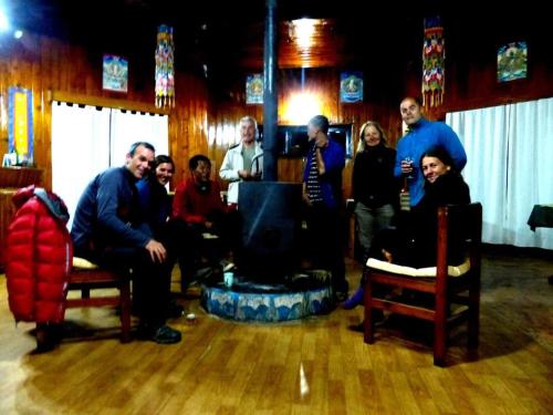 a group of people posing for a picture in a room at Lukla Airport Resort Lukla in Lukla