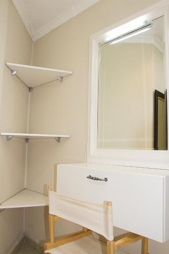 a dressing room with a mirror and a bench at Matusadona Guest Lodge in Hillcrest