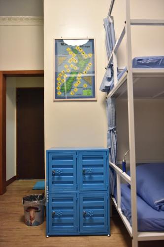 Ένα ή περισσότερα κρεβάτια σε δωμάτιο στο 123 Cheers Hostel