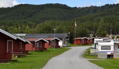 a village of houses and a road with a mountain at First Camp Gol Hallingdal in Gol