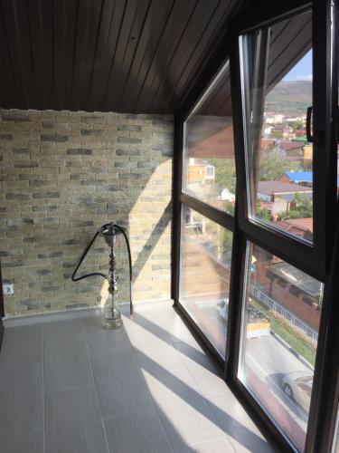 a room with a window with a shower in it at Квартира в центре in Gelendzhik