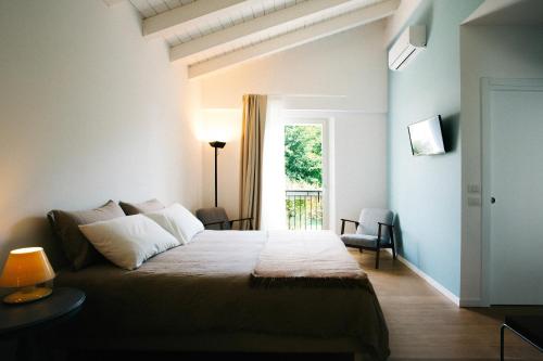 Säng eller sängar i ett rum på SoloQui