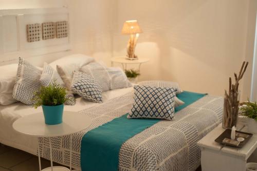 a living room with a couch and a table with pillows at Portadamare in Trani