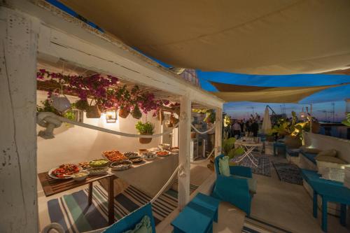 a balcony with a table with food on it at Portadamare in Trani