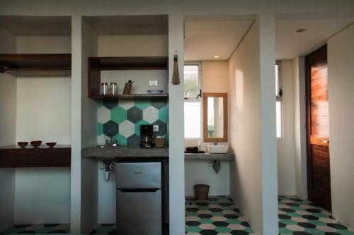 Virtuvė arba virtuvėlė apgyvendinimo įstaigoje Suites Cielo y Mar