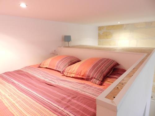 En eller flere senge i et værelse på B&B Bordeaux Saint Michel
