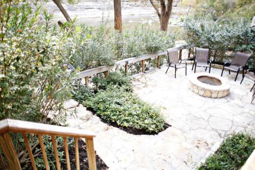 a patio with two chairs and a fire pit at Tiki Loft 3 in Third Crossing