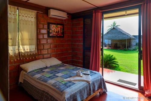 A bed or beds in a room at Bungalows El Palmiche