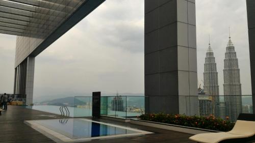 a view of the petronas twin towers from a building at Platinum KLCC Serviced Suites in Kuala Lumpur