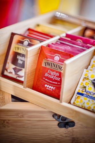 a wooden drawer with differentiatesiatesiatesiatesiatesktop at Vela Rooms in Cagliari