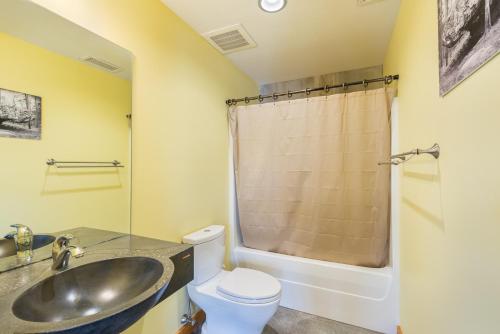 a bathroom with a sink and a toilet at The Crash Pad: An Uncommon Hostel in Chattanooga