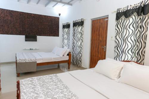 Ein Bett oder Betten in einem Zimmer der Unterkunft Rock Haven Wayanad