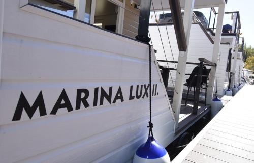 a boat with the name marina lynx on the side at Floating Sea Houses MARINA LUX in Portorož