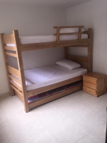 a couple of bunk beds in a room at Hacienda Penalisa Mango in Girardot