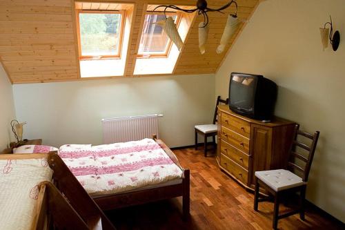 En eller flere senger på et rom på Belweder Apartments