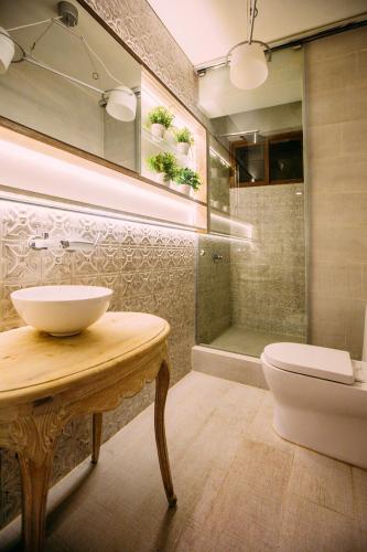 a bathroom with a sink and a toilet and a shower at Casa Azul in Lima