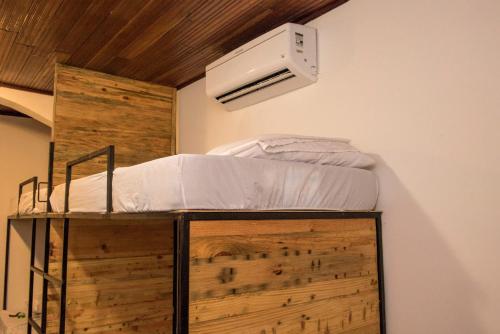 a bedroom with a bunk bed with a ceiling at El Caite Hostel in Granada