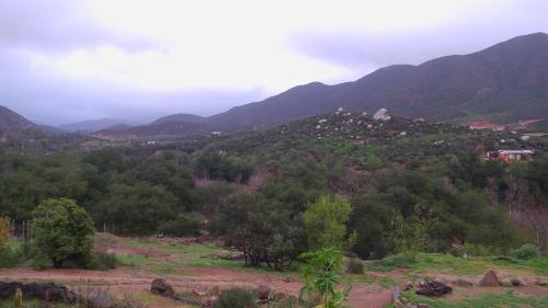 a view of a mountain with a town on a hill at Quinta Maria en la Ruta del Vino in Valle de Guadalupe