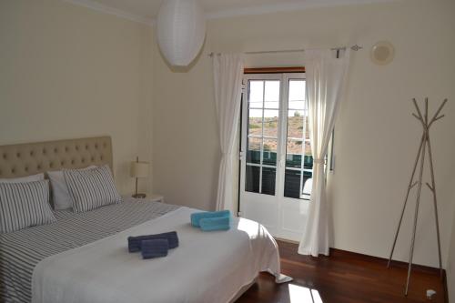 Ένα ή περισσότερα κρεβάτια σε δωμάτιο στο Yellow House Ericeira