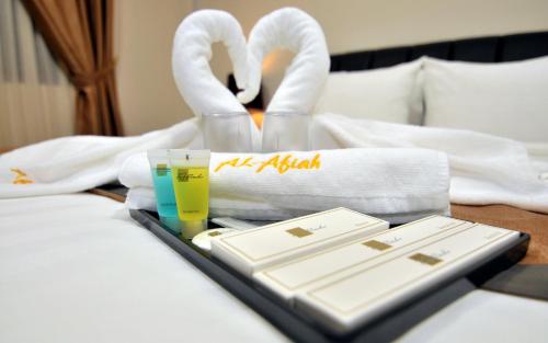 Ένα ή περισσότερα κρεβάτια σε δωμάτιο στο Al Afiah Hotel