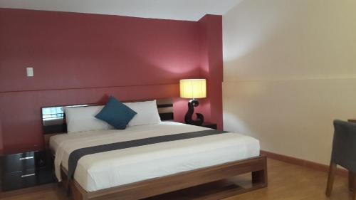 Postel nebo postele na pokoji v ubytování YBC Grand Hotel