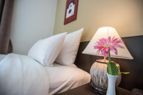 Ein Bett oder Betten in einem Zimmer der Unterkunft Northgate Ratchayothin