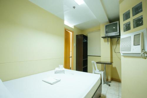 Kuchyň nebo kuchyňský kout v ubytování GV Hotel - Talisay City