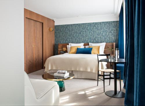 Säng eller sängar i ett rum på Hotel Parister & Spa