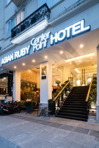 an asian riley hotel with stairs in front of it at Asian Ruby Center Point Hotel & Spa in Ho Chi Minh City