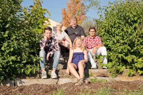 a group of people sitting on some steps at Hotel Braun in Fahr