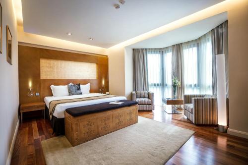 Кровать или кровати в номере Достык Отель