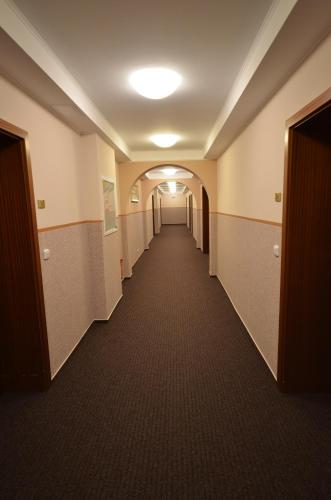 a hallway in an office building with a long corridor at Teplice Plaza in Teplice