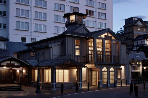 a building with lights on in front of a building at 湯宿みゆきYuyado Miyuki in Kusatsu