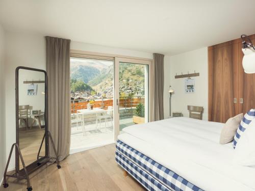 Voodi või voodid majutusasutuse OVERLOOK Lodge by CERVO Zermatt toas