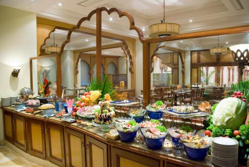 a buffet table filled with lots of different types of food at Avari Lahore Hotel in Lahore