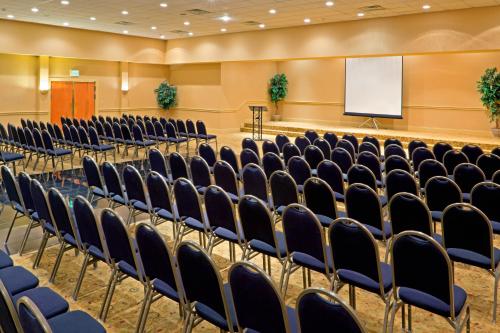 an empty auditorium with chairs and a whiteboard at Red Lion Hotel Harrisburg Hershey in Harrisburg