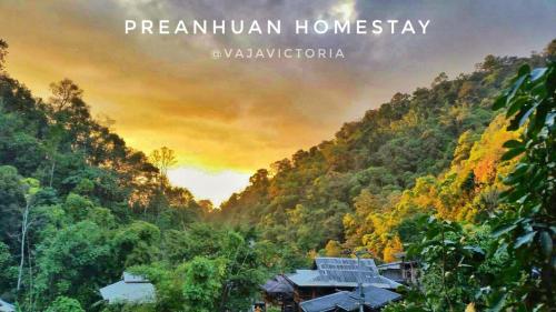 a view of a mountain with a house in the forest at Preanhuan Homestay in Mae On