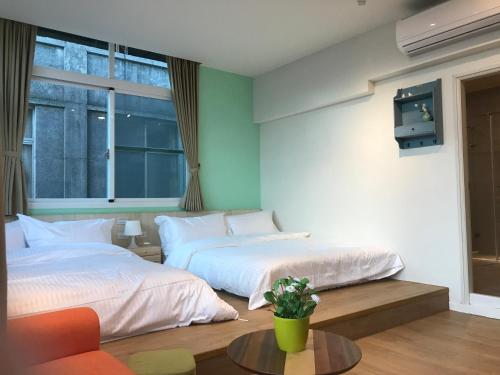 En eller flere senge i et værelse på Zhai Nan