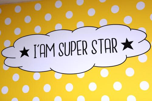 a banner with the words i am super star at Logis Boutique Hotel Novalis in Gradignan