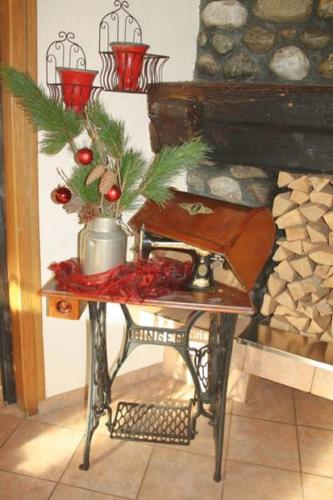 a table with a christmas tree on top of it at Alpenlandhof in Bad Kleinkirchheim