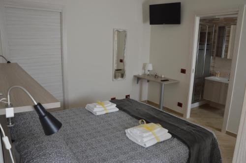 Кровать или кровати в номере Guest House - Il Granaio